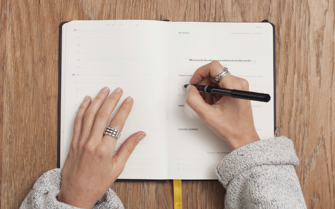 Woman writing on a journal